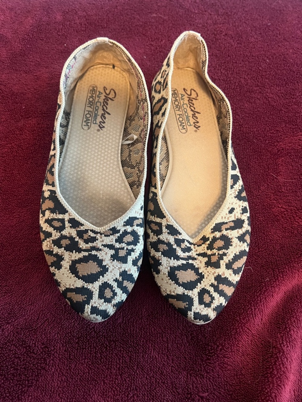 Skechers Leopard-Print Slip-On Flats in Beige and Black